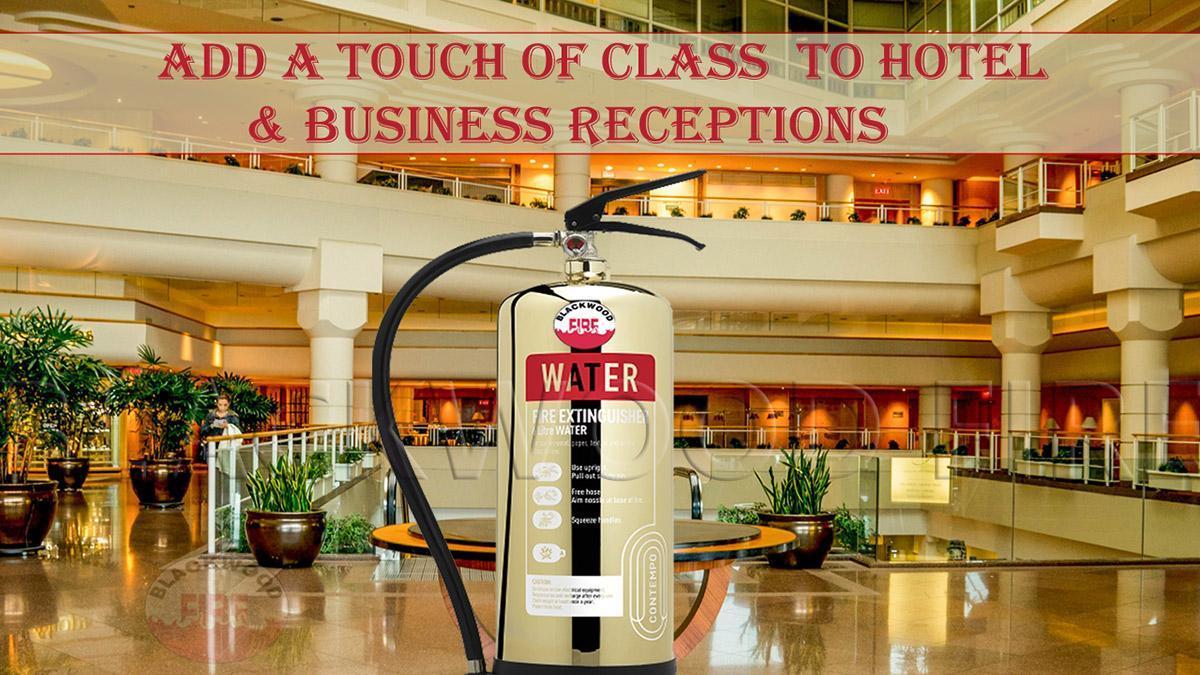 Polished gold fire extinguisher in hotel reception -Designer gold, silver and copper finish fire extinguishers