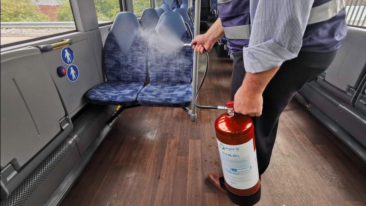Rapid-10 anti-virus sanitiser being applied on public transport, in this example on a bus